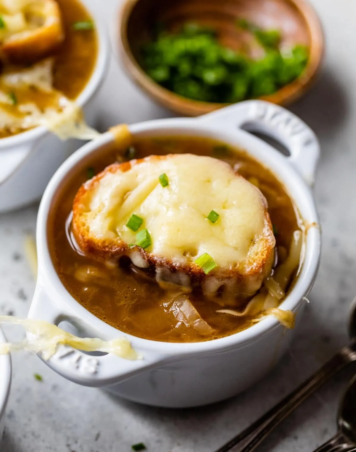 French onion soup in a ceramic crock with melted cheese