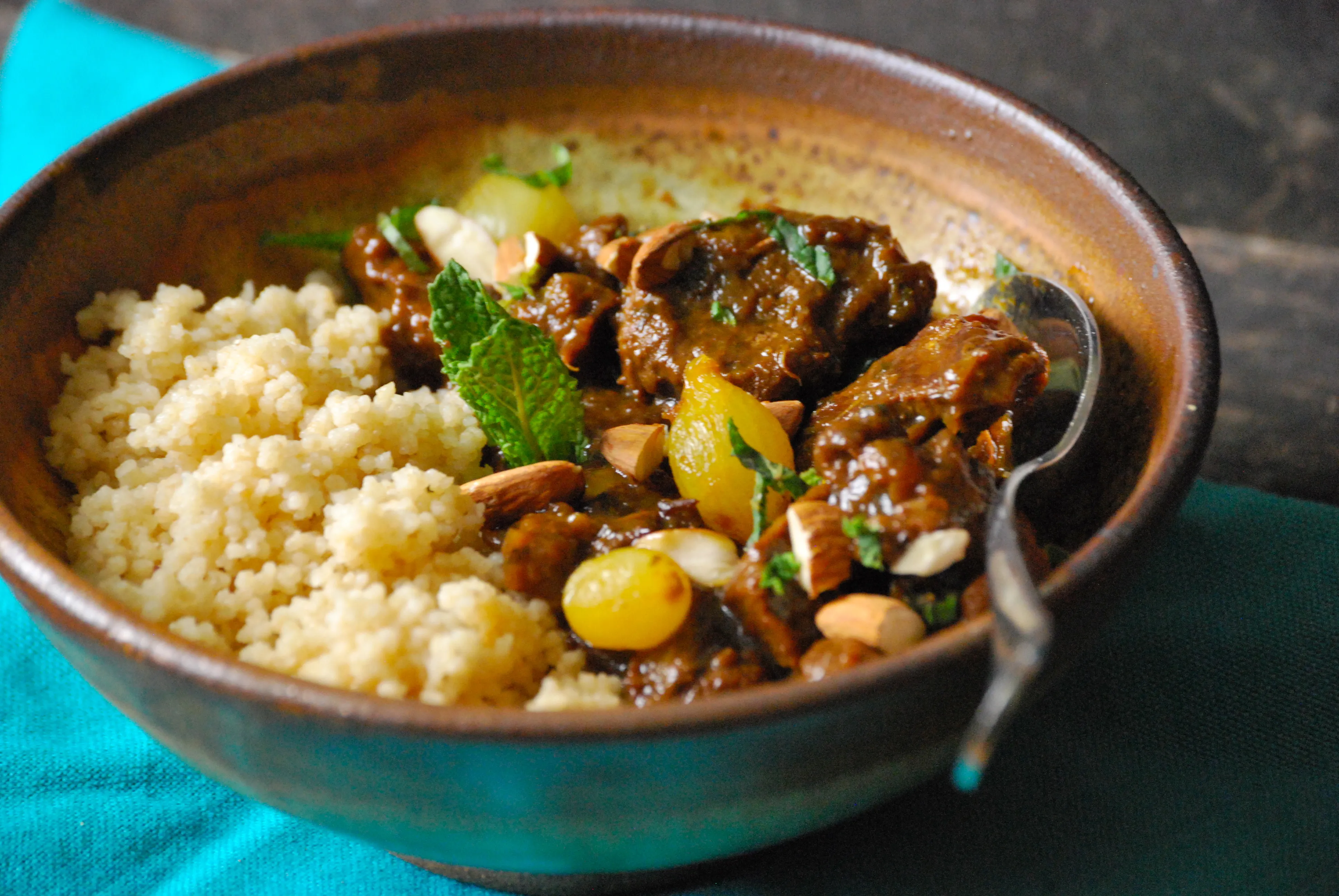 Lamb tagine with apricots and almonds in a traditional clay pot