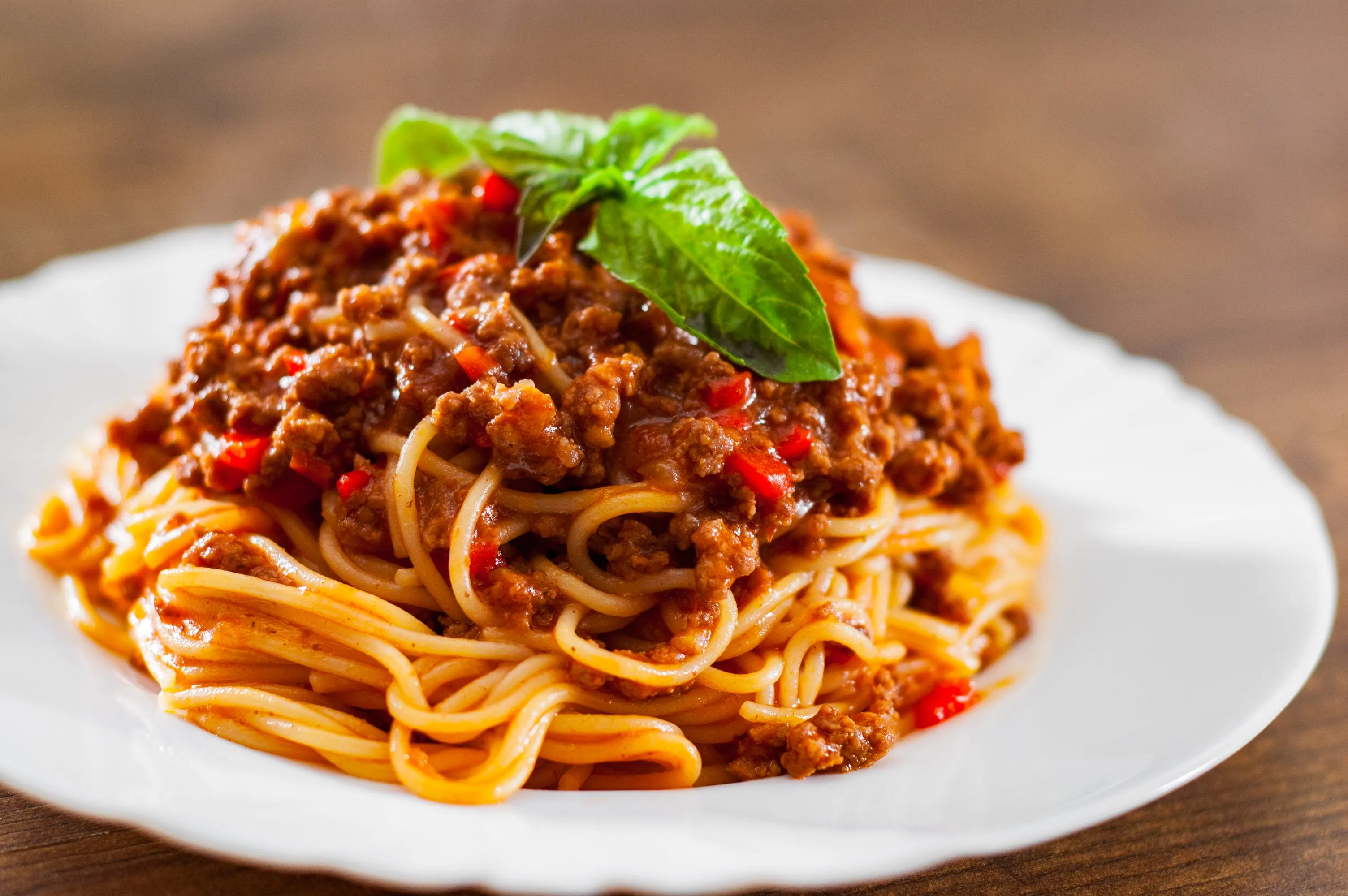 A beautiful Spaghetti Bolognese dish with parmesan cheese
